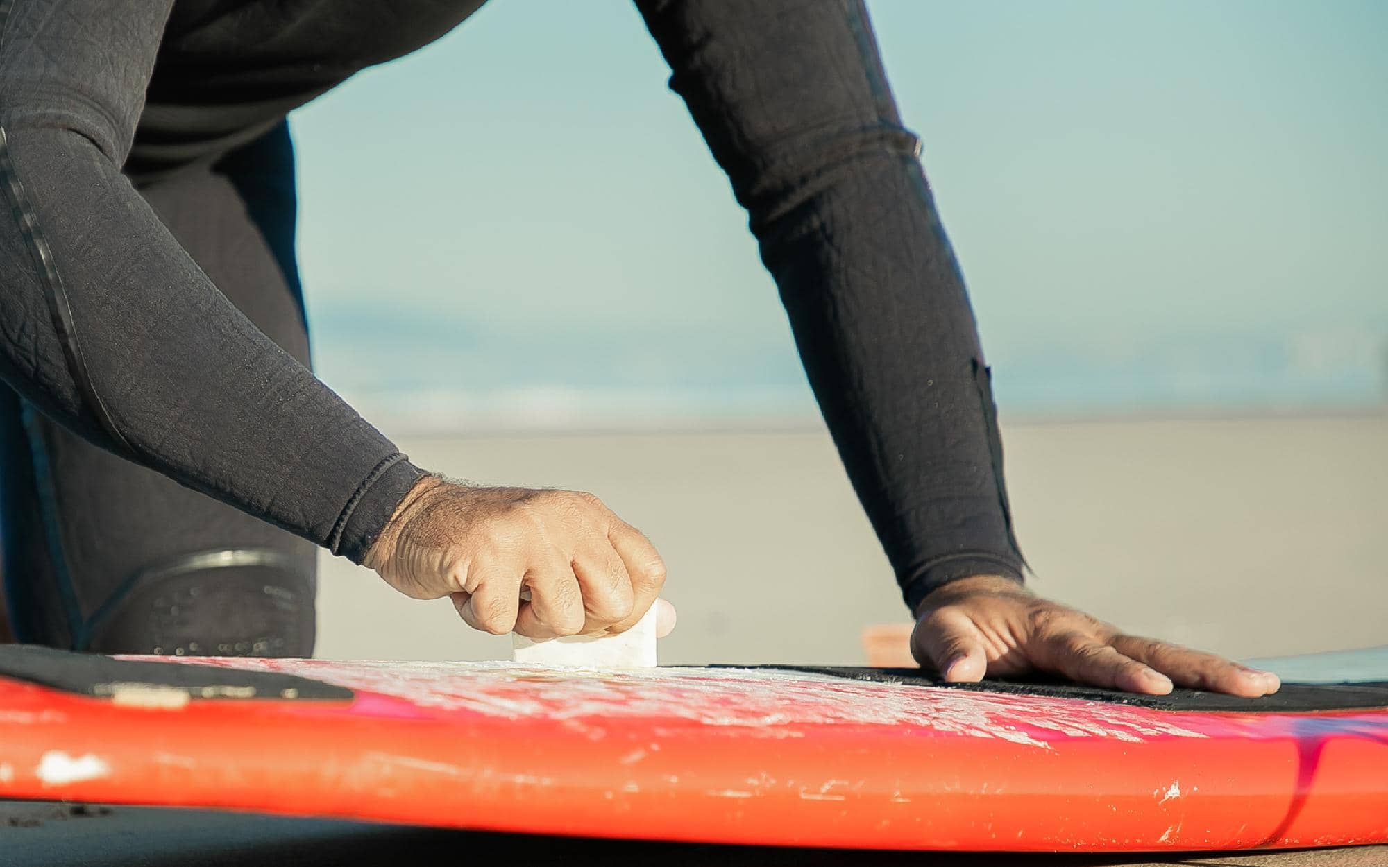 cleaning a surfboard